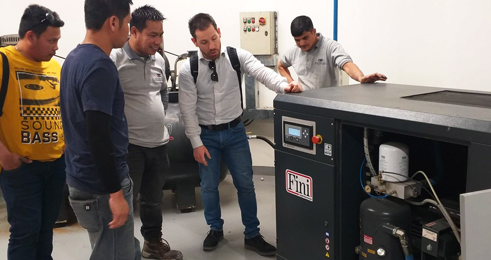 Fini conducts technical training in air compressor maintenance